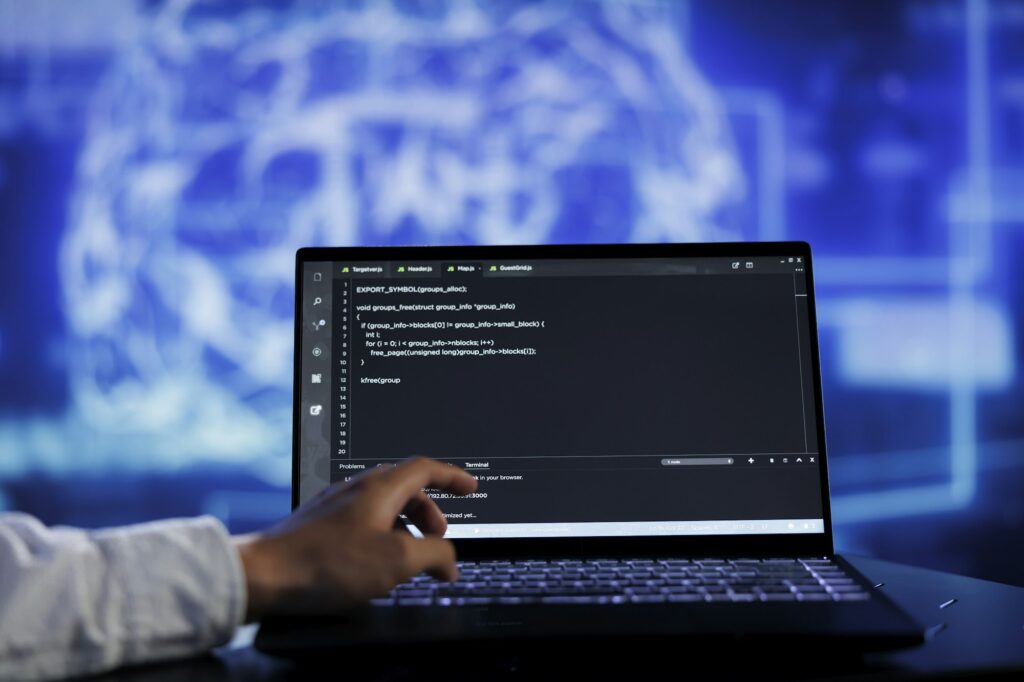 Expert writes AI code on laptop
